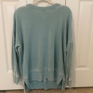 a light blue crewneck, supper comfy